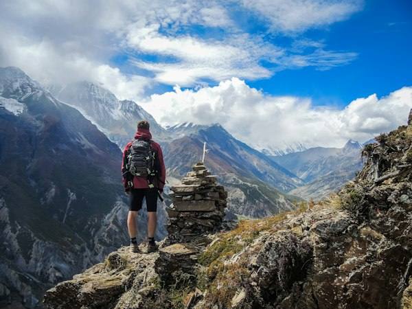 Traveller looking across a mountain valley